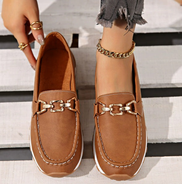 Women's flat loafers with metal buckle detail and round toes