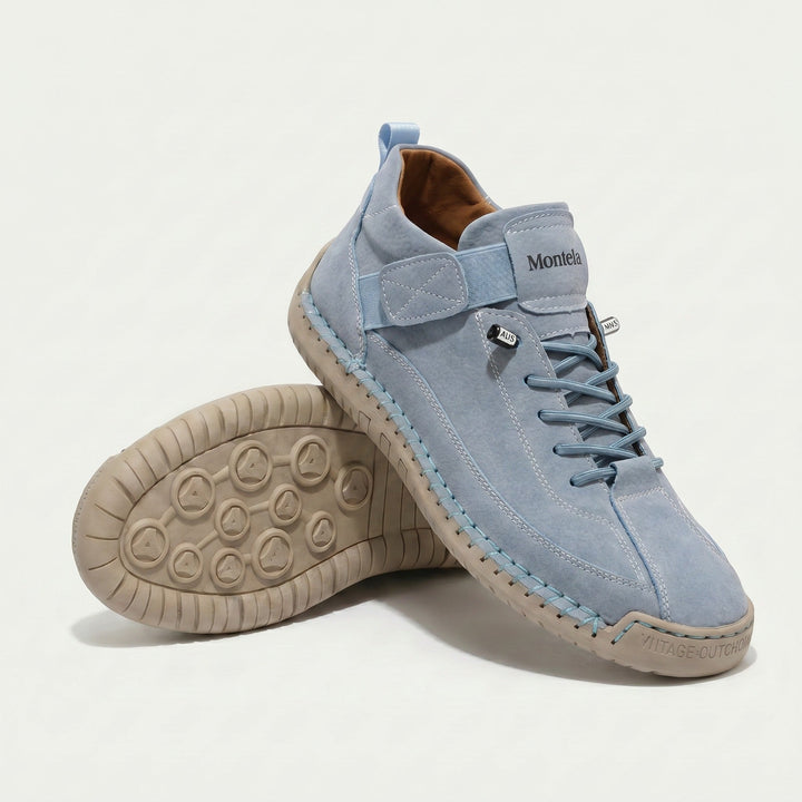 High-top lace-up sneakers with stitched panels, side strap detail and textured flat soles