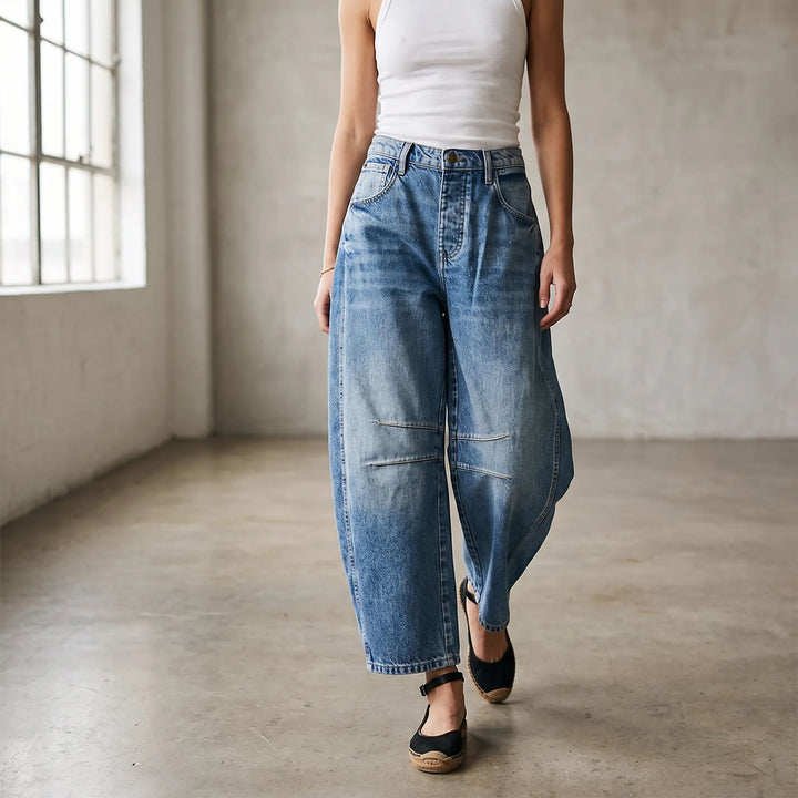 Women's cropped wide-leg jeans with curved legs and knee seam detailing