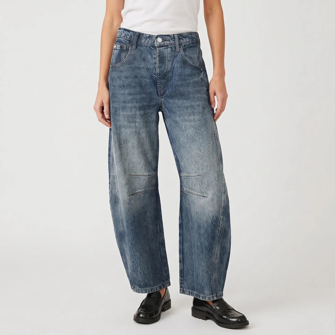 Women's cropped wide-leg jeans with curved legs and knee seam detailing