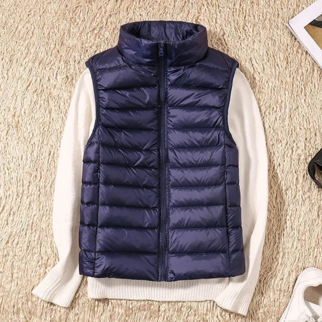 Women's sleeveless quilted puffer vest with raised collar and front zip