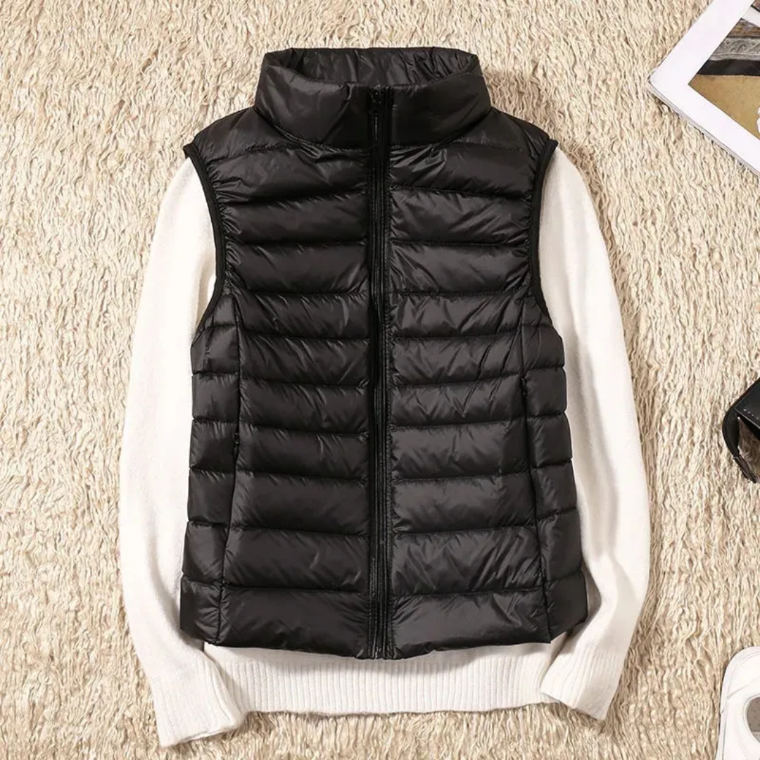 Women's sleeveless quilted puffer vest with raised collar and front zip