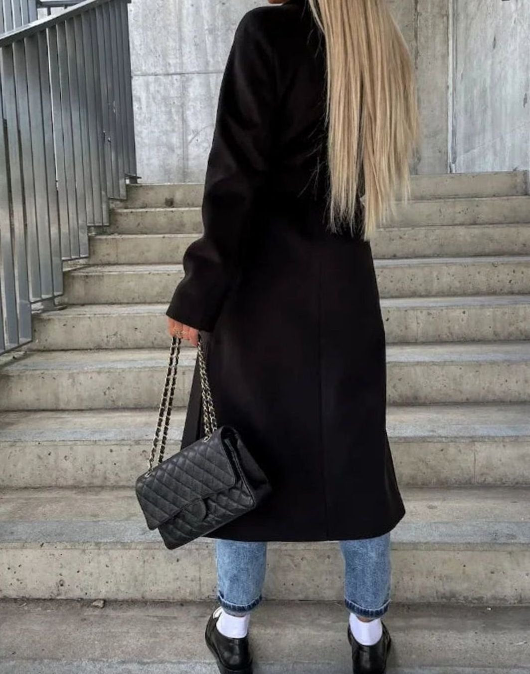 Women's long coat with notched lapel, button front, long sleeves and front pockets