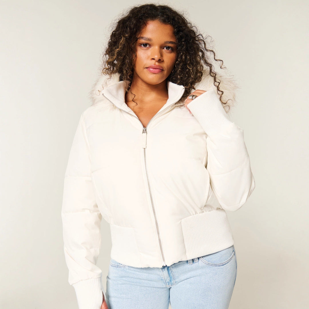 Women's quilted hooded jacket with fur-trimmed hood and ribbed cuffs