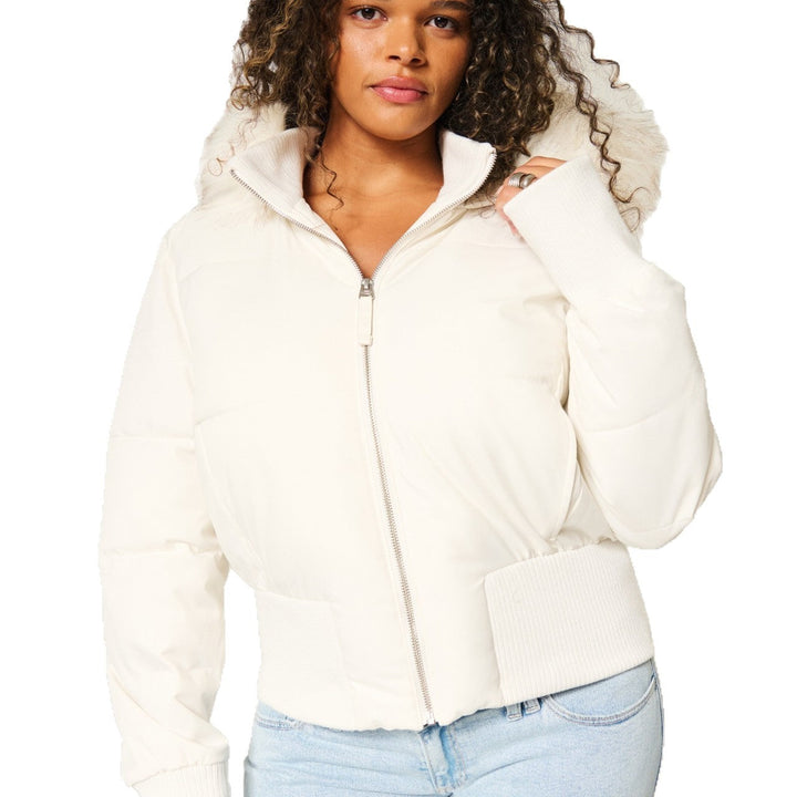 Women's quilted hooded jacket with fur-trimmed hood and ribbed cuffs