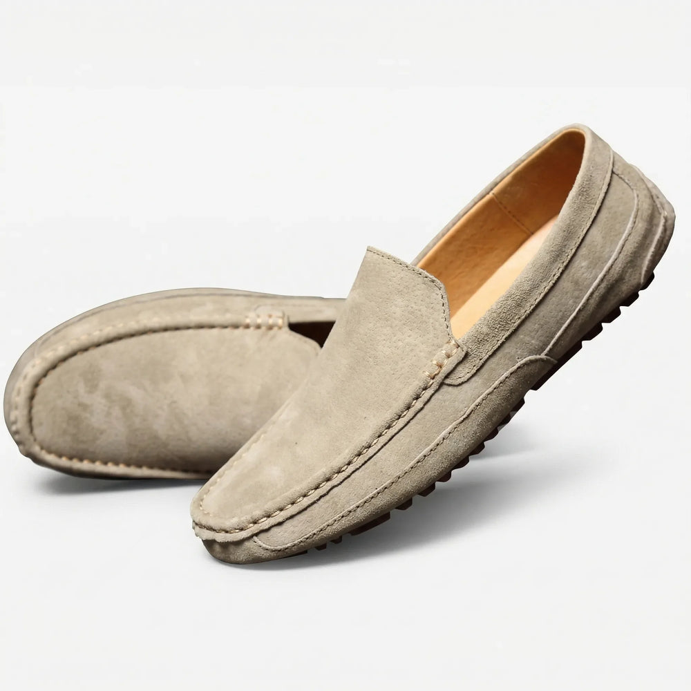 Men's slip-on moc toe loafers with stitched trim and lugged soles