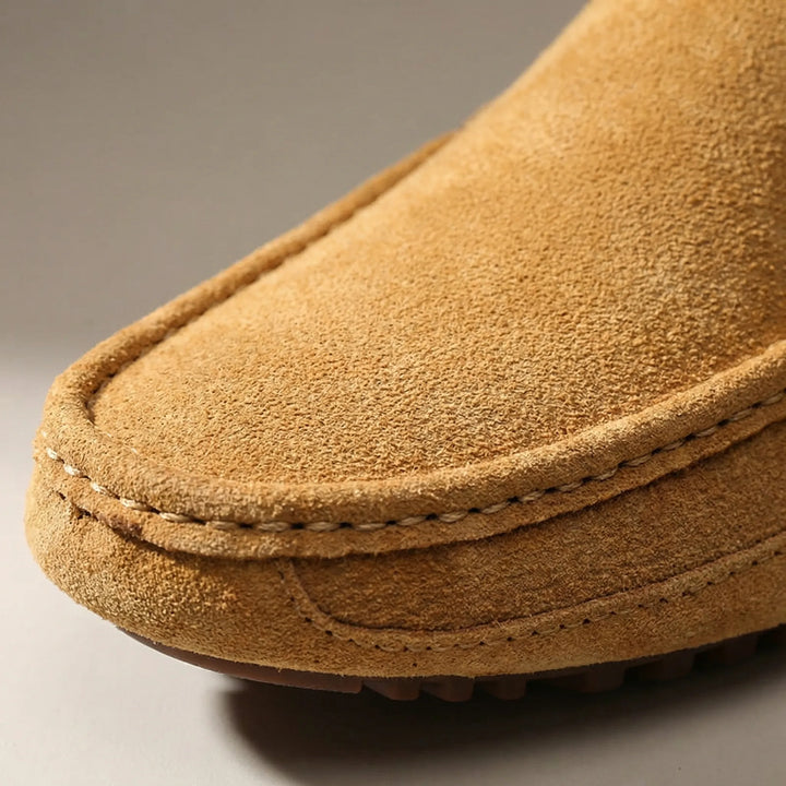 Men's slip-on moc toe loafers with stitched trim and lugged soles