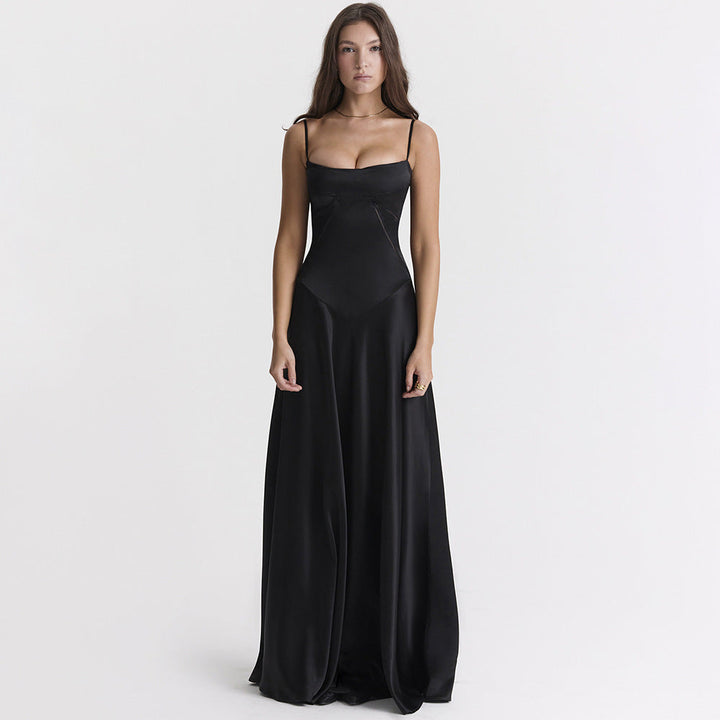 Women's black maxi dress with cowl neckline and cami straps, showing full-length floor skirt and back tie detail