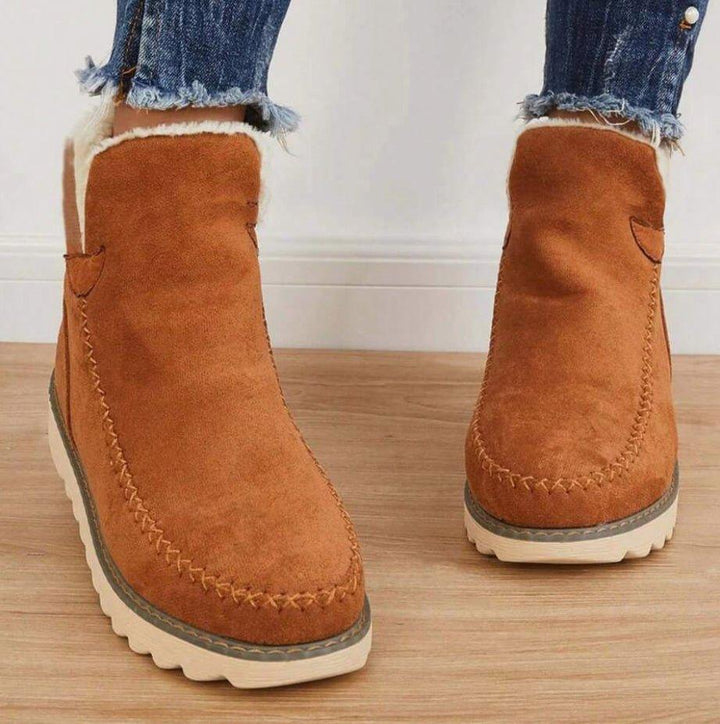 Women's fur-trimmed slip-on ankle boots with platform soles