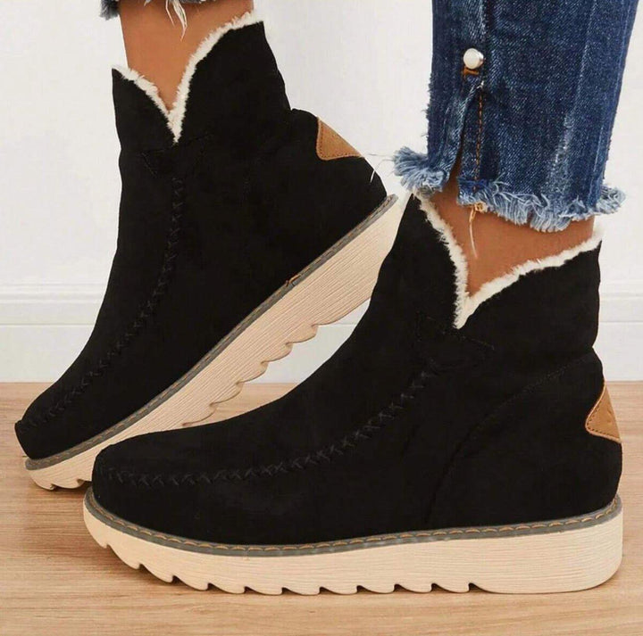 Women's fur-trimmed slip-on ankle boots with platform soles
