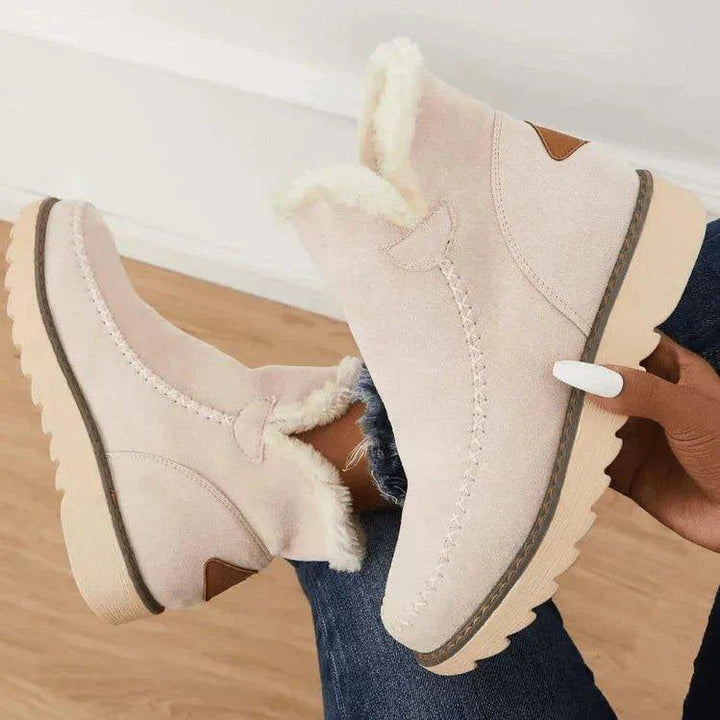 Women's fur-trimmed slip-on ankle boots with platform soles