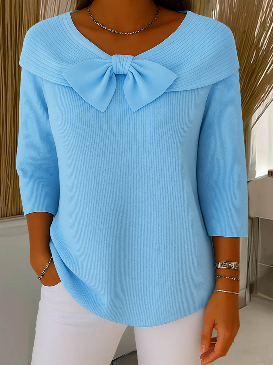 Women's ribbed sweater with large front bow and three-quarter sleeves