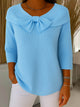 Women's ribbed sweater with large front bow and three-quarter sleeves