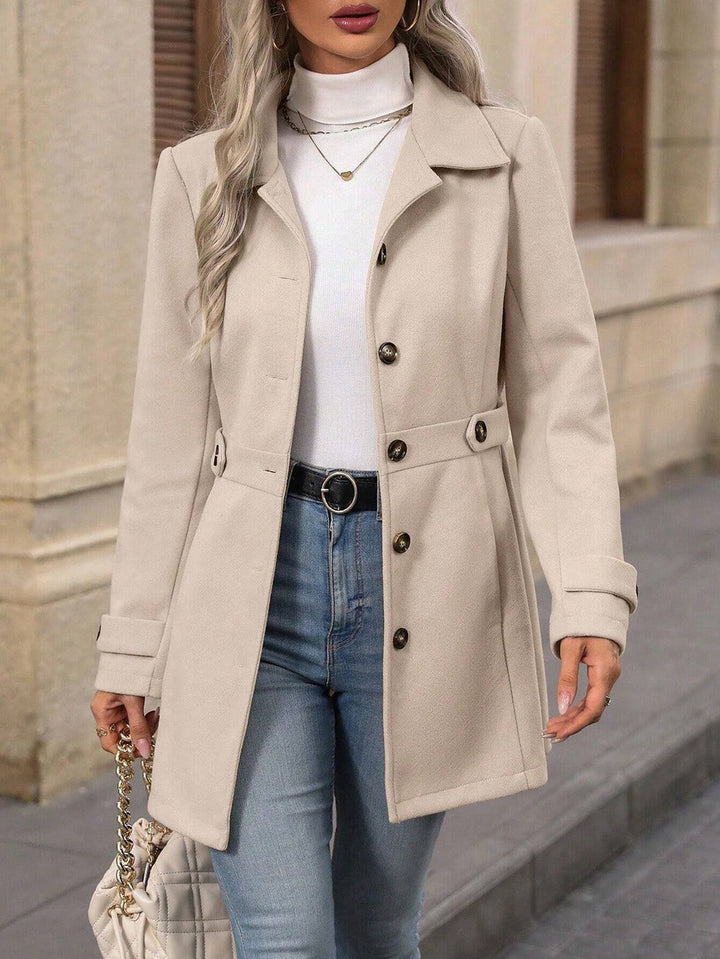 Women's tailored belted trench coat with notched lapels and long sleeves