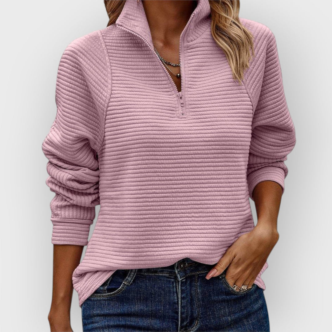 Women's ribbed knit sweater with raised collar and zip neck