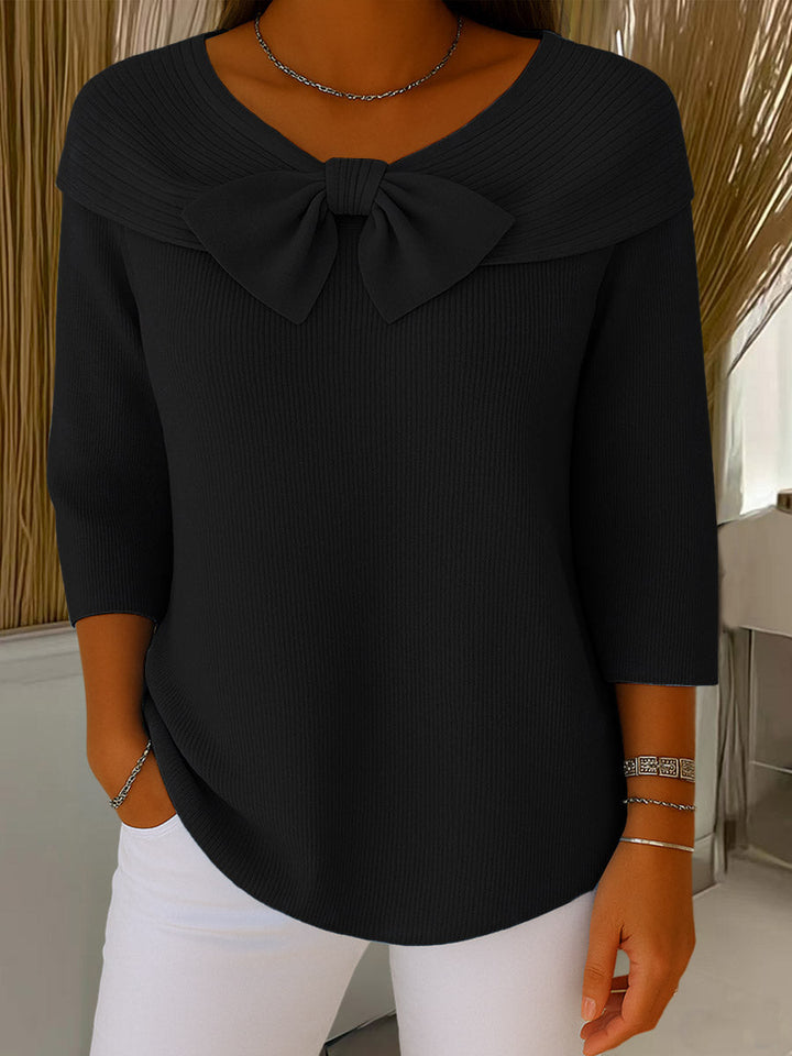 Women's ribbed sweater with large front bow and three-quarter sleeves