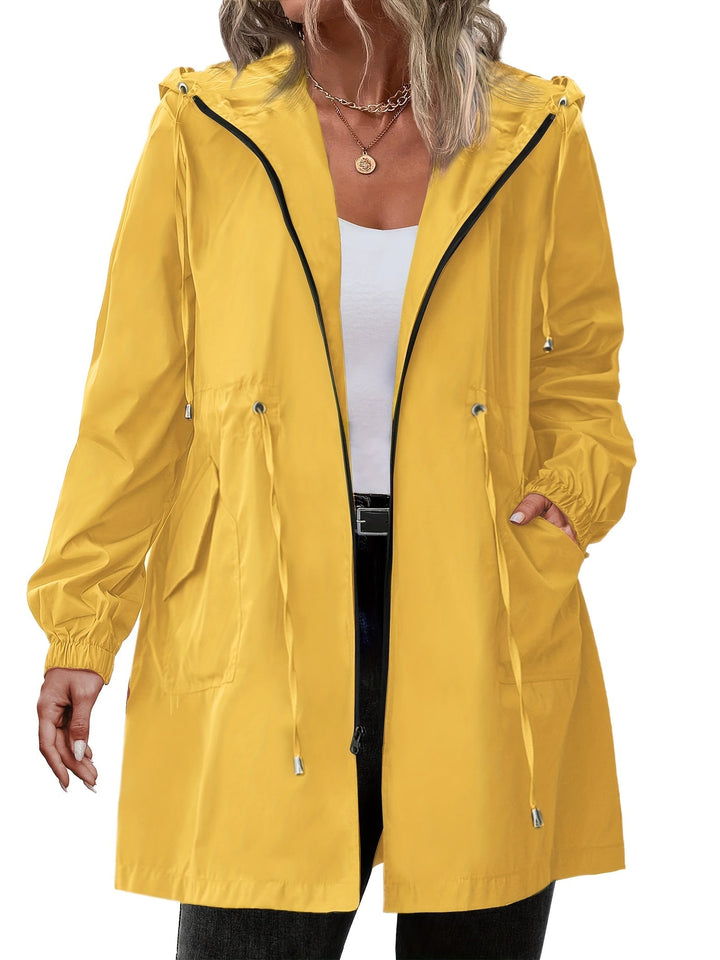 Women's long hooded raincoat with zip front, drawstring waist and front pockets