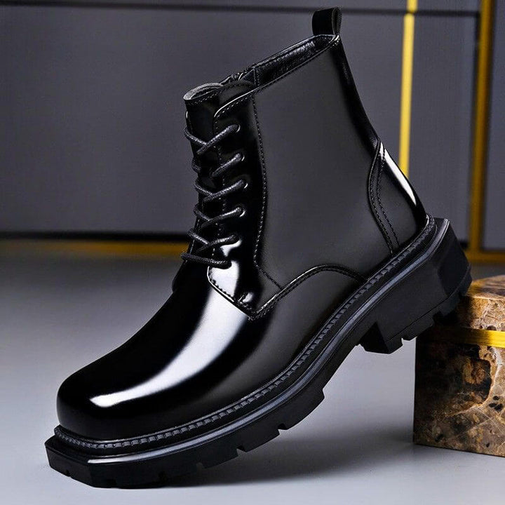 Lace-up ankle boot with a polished upper, rounded toe and chunky tread sole