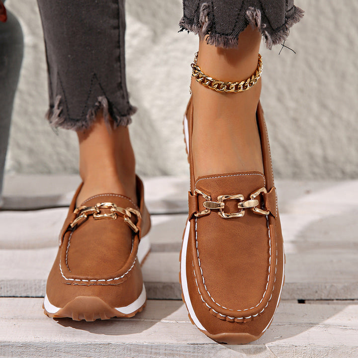 Women's flat loafers with metal buckle detail and round toes