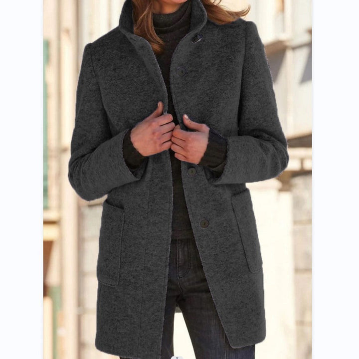 Women's long button-front coat with stand collar and patch pockets