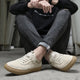 Men's low-top lace-up sneakers with textured rubber soles