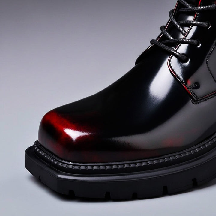 Lace-up ankle boot with a polished upper, rounded toe and chunky tread sole