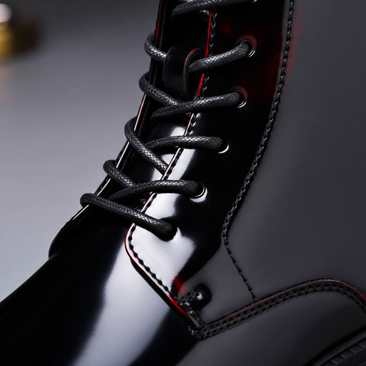 Lace-up ankle boot with a polished upper, rounded toe and chunky tread sole