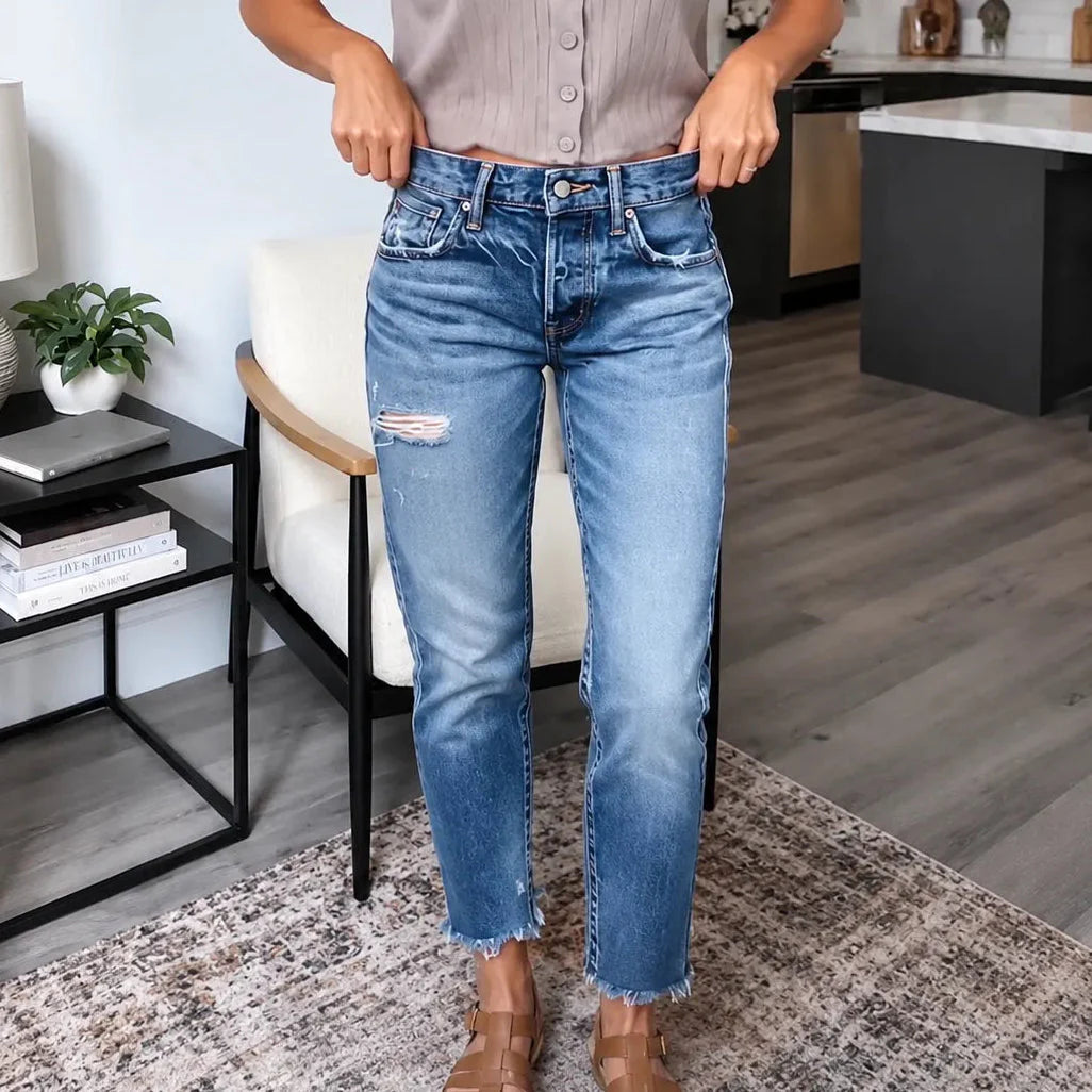 Women's blue distressed straight leg jeans with cropped frayed hems