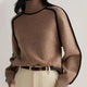 Women's turtleneck sweater with black contrast piping and long sleeves