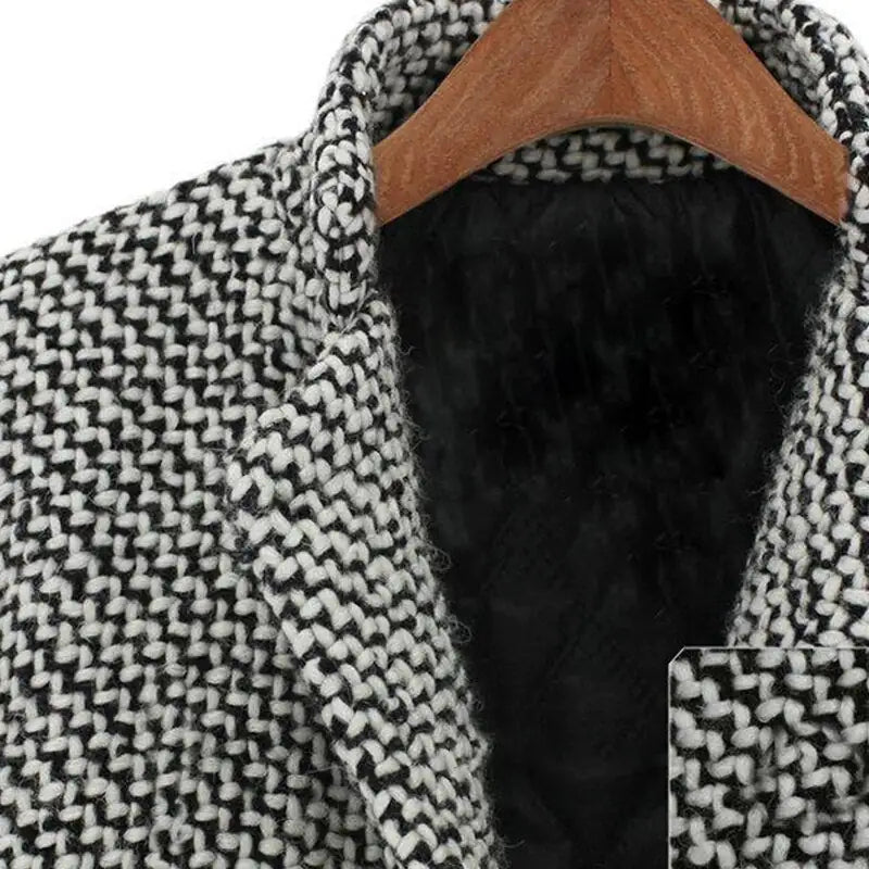 Women's black and white houndstooth long coat with notched lapels and button fastening