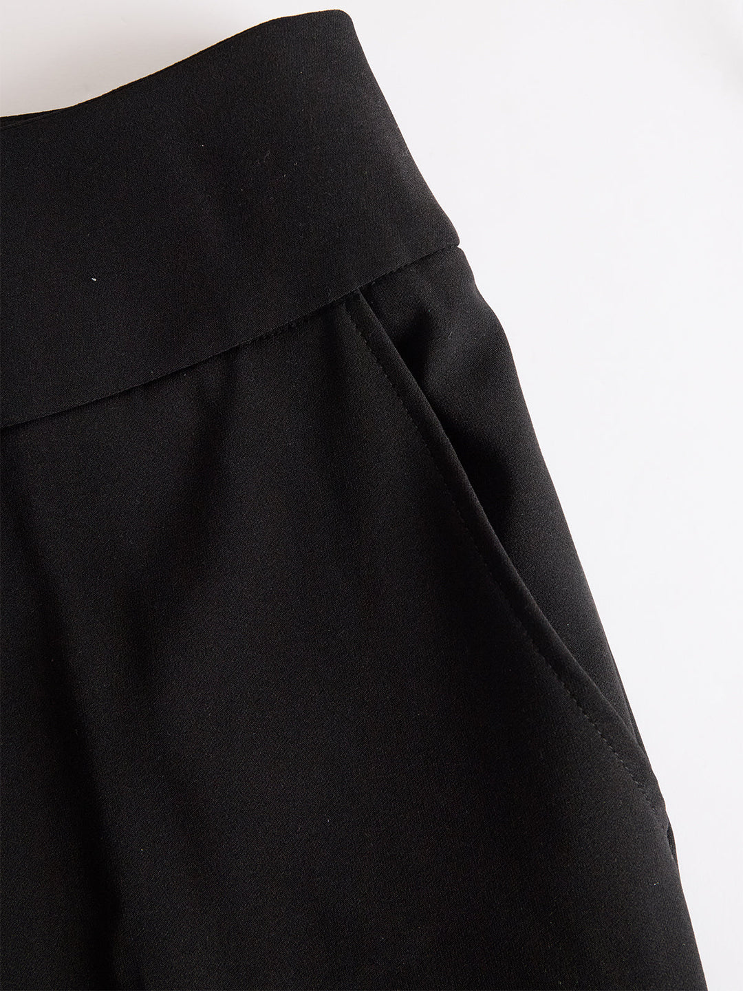Women's three-piece set with sheer puff-sleeve top, fitted camisole and wide-leg trousers, shown in black and navy blue.