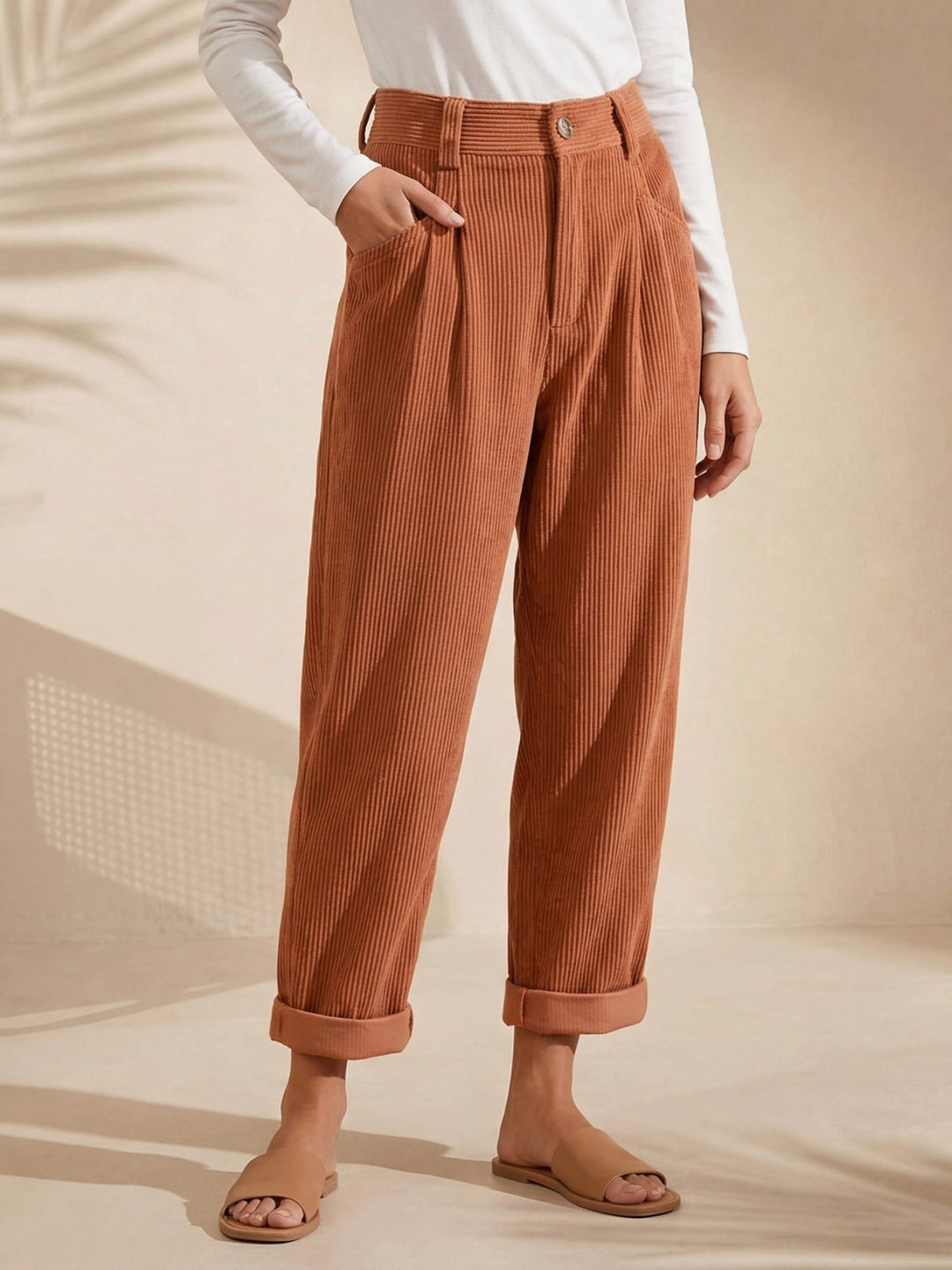 Women's high-waisted corduroy trousers with straight legs and turned-up cuffs