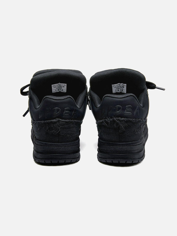 Black unisex high top trainers with lace-up fronts and camouflage panels