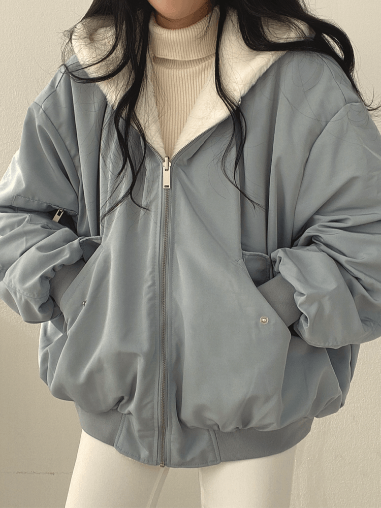 Women's reversible hooded jacket with zip front, gathered sleeves and ribbed hem