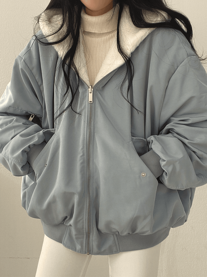 Women's reversible hooded jacket with zip front, gathered sleeves and ribbed hem