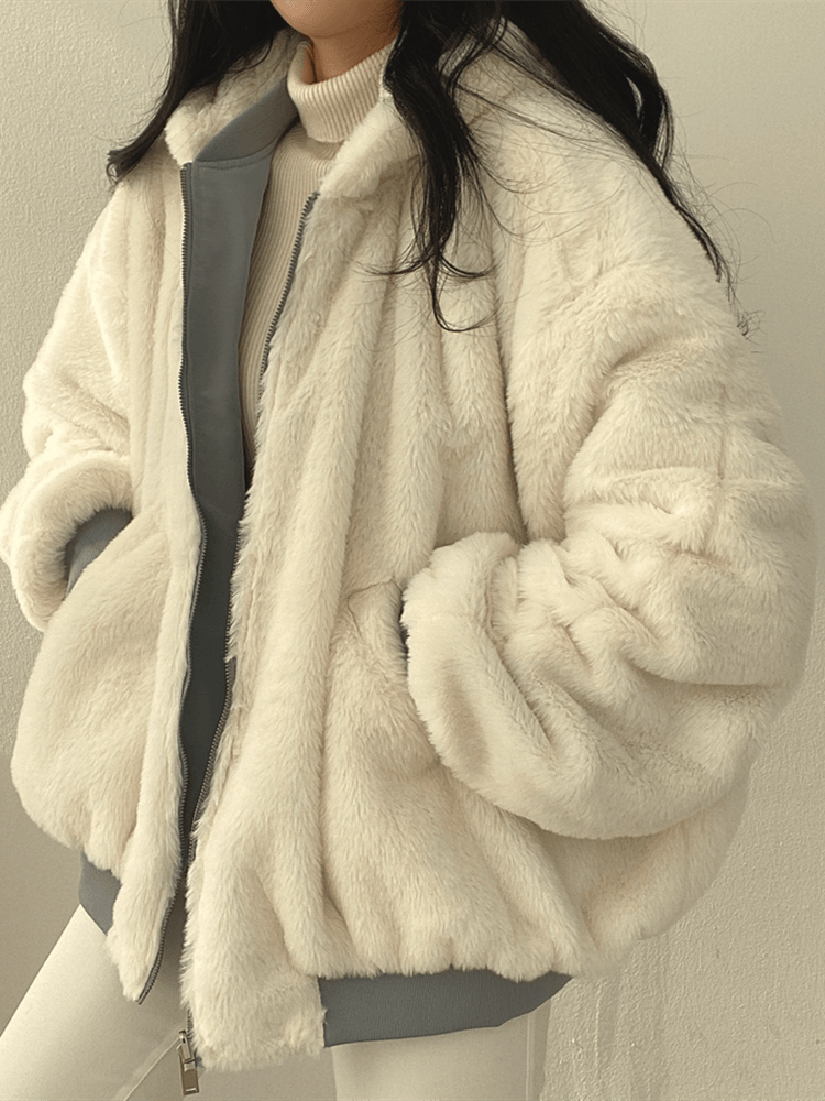 Women's reversible hooded jacket with zip front, gathered sleeves and ribbed hem