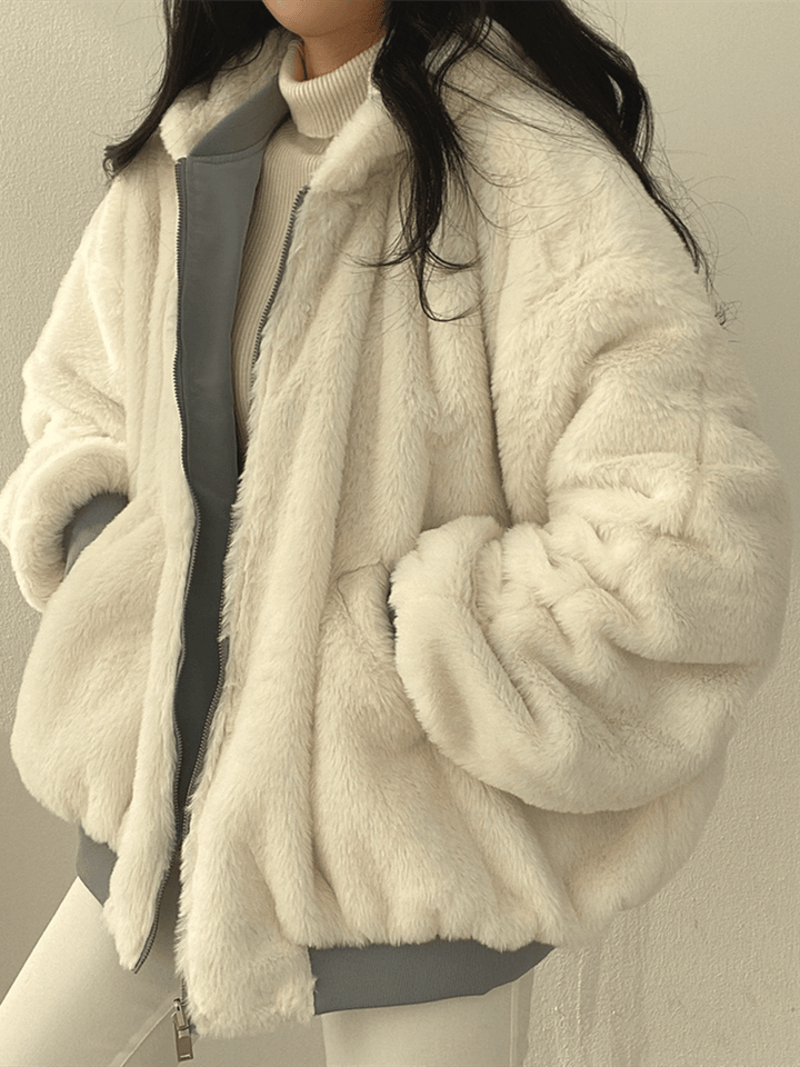 Women's reversible hooded jacket with zip front, gathered sleeves and ribbed hem