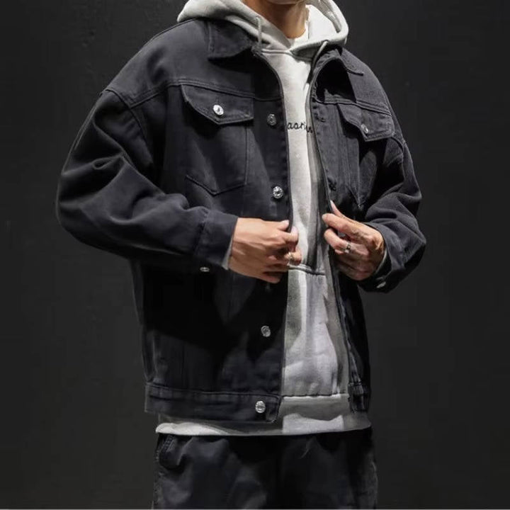 Men's button-front denim jacket with flap chest pockets and long sleeves