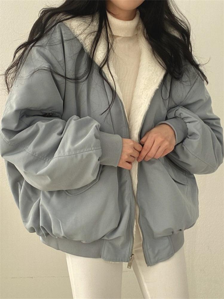 Women's reversible hooded jacket with zip front, gathered sleeves and ribbed hem