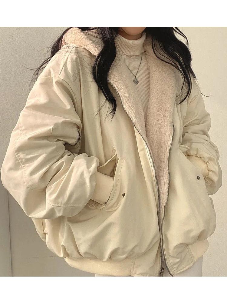 Women's reversible hooded jacket with zip front, gathered sleeves and ribbed hem