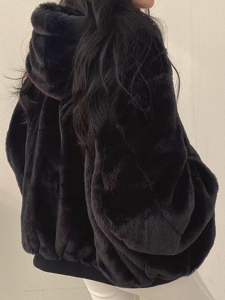 Women's reversible hooded jacket with zip front, gathered sleeves and ribbed hem