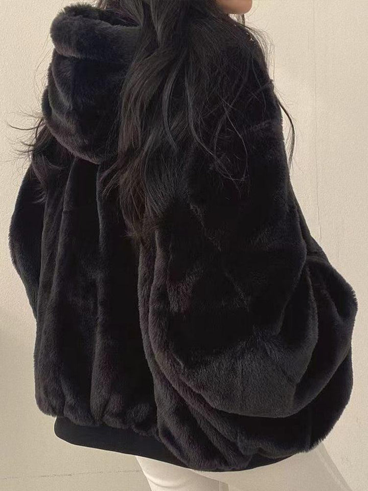 Women's reversible hooded jacket with zip front, gathered sleeves and ribbed hem