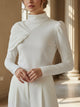 White women's high-neck long-sleeve top with asymmetric pleated shoulder detail