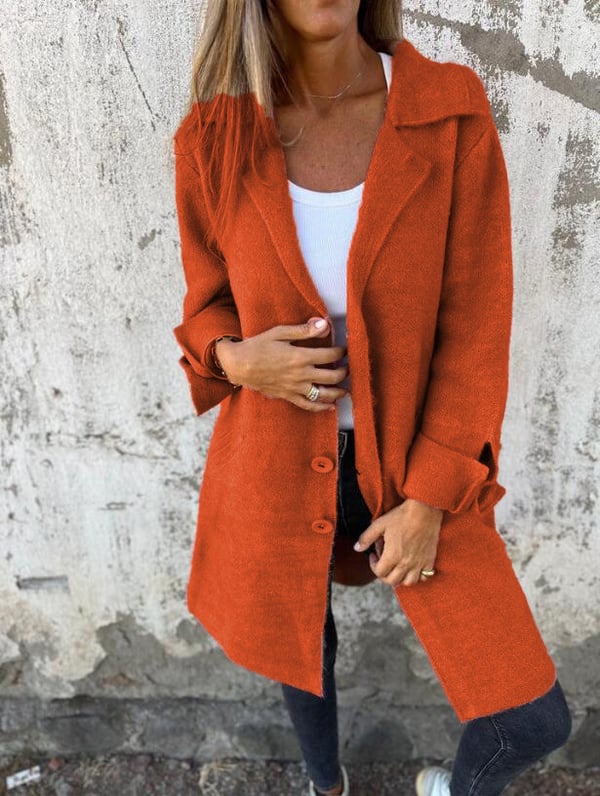 Women's long button-front coat with notched lapels and patch pockets
