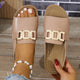 Women's white and tan buckle sandal with gold-toned buckle detail, open toe, flat sole