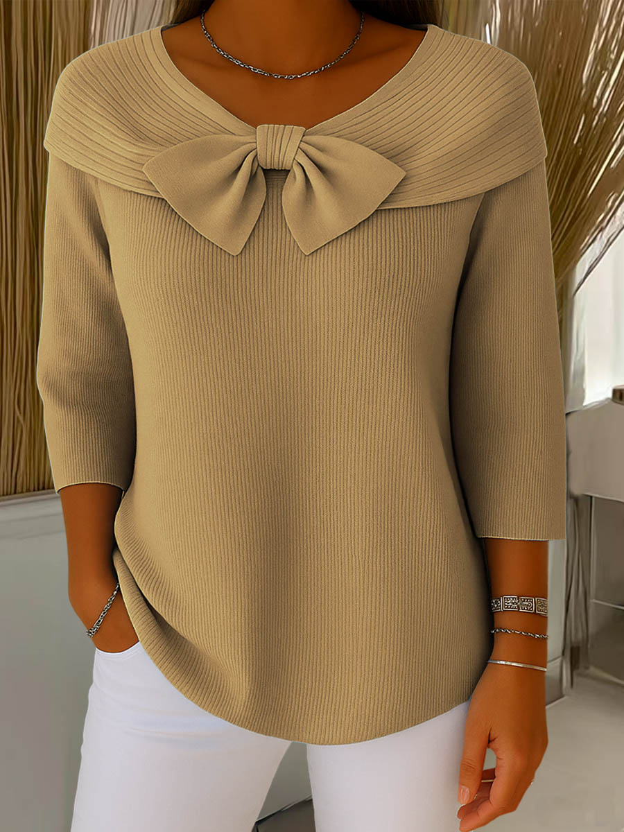 Women's ribbed sweater with large front bow and three-quarter sleeves