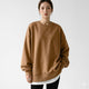 Women's oversized crew neck sweatshirt with long sleeves and curved hem