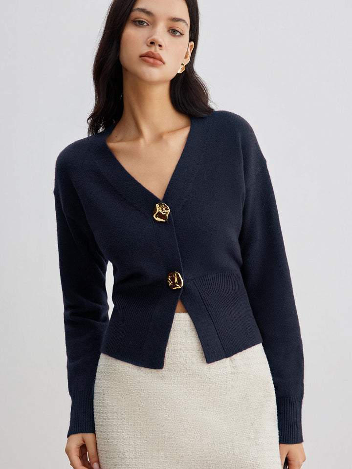 Women's short plain V-neck cardigan with long sleeves and decorative button front