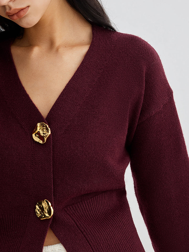 Women's short plain V-neck cardigan with long sleeves and decorative button front