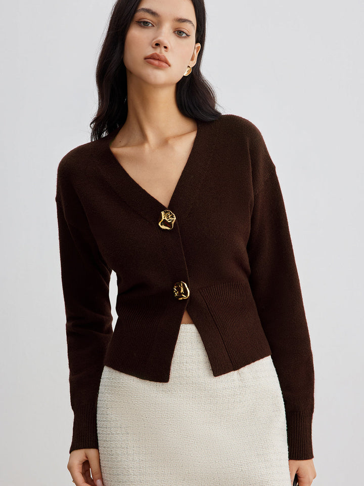 Women's short plain V-neck cardigan with long sleeves and decorative button front